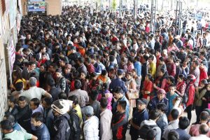 People stand in queues to book bus tickets for their hometowns to celebrate the Dashain festival, at Naya bus park, in Gongubu, on Tuesday. Advance ticket bookings were opened on Tuesday. Some were said to have stood in lines overnight to secure their tickets as early as possible. POST PHOTO: KESHAV THAPA/KATHMANDU POST