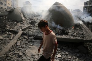 Palestinians inspect the damage following an Israeli airstrike on the Sousi mosque in Gaza City on October 9, 2023-reuters