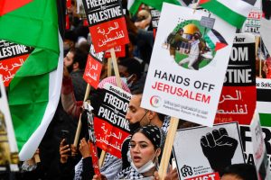 Pro-Palestinian demonstrators attend a protest following a flare-up of Israeli-Palestinian violence, in London, Britain May 11, 2021. REUTERS/Toby Melville